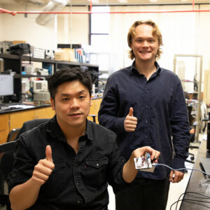 Nicholas Heinrich-Barna and Peng-Hao Huang working on hardware in a lab. | Image: Texas A&M Engineering.